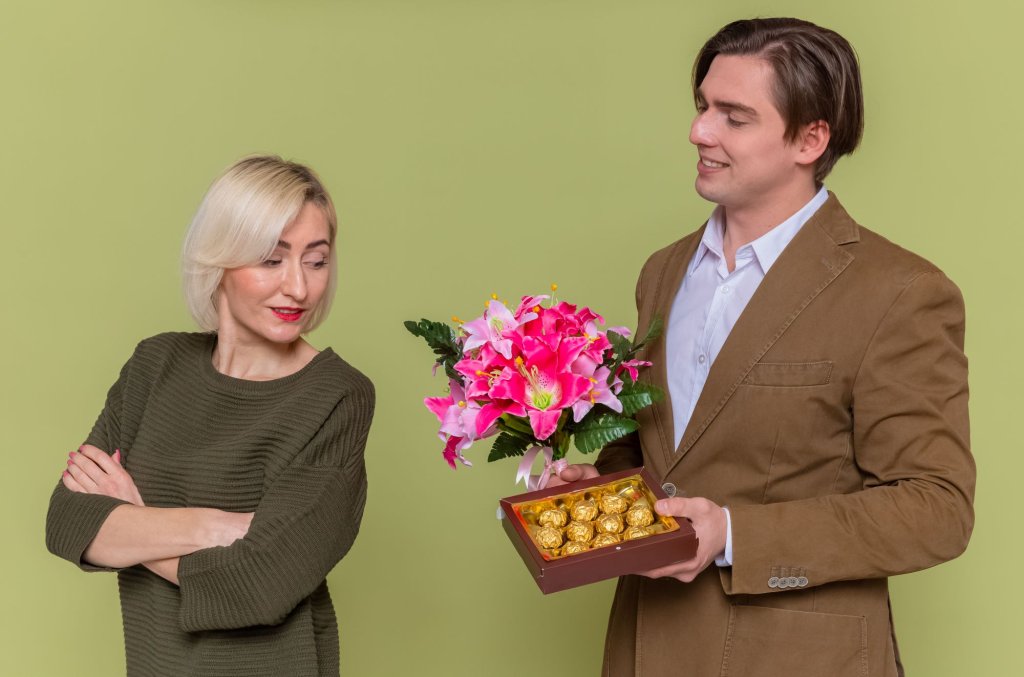 young-beautiful-couple-happy-man-giving-box-chocolate-candies-bouquet-flowers.jpg young-beautiful-couple-happy-man-giving-box-chocolate-candies-bouquet-flowers.jpg