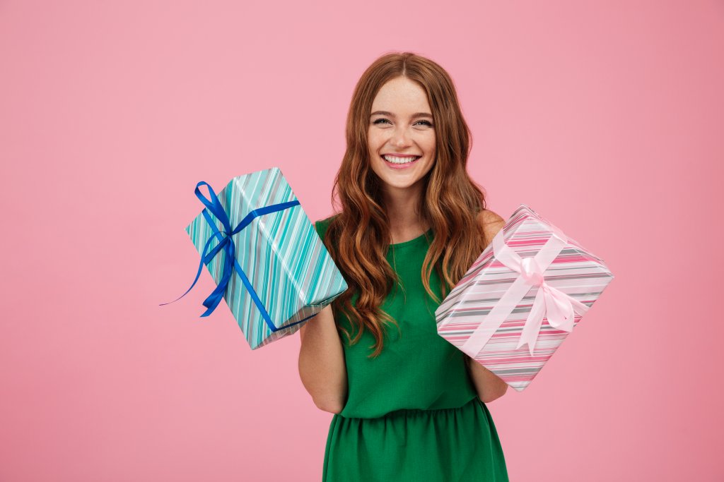 portrait-of-a-happy-woman-in-dress-holding-present-boxes.jpg portrait-of-a-happy-woman-in-dress-holding-present-boxes.jpg